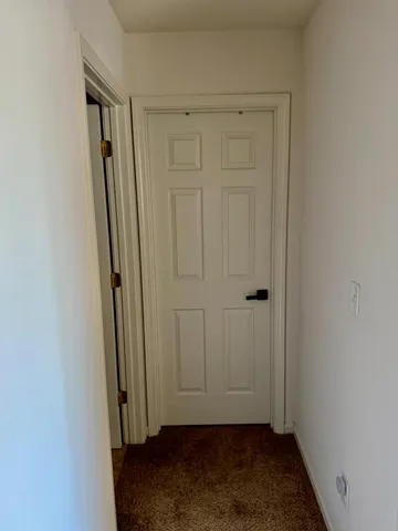 a bedroom with a bed and dresser