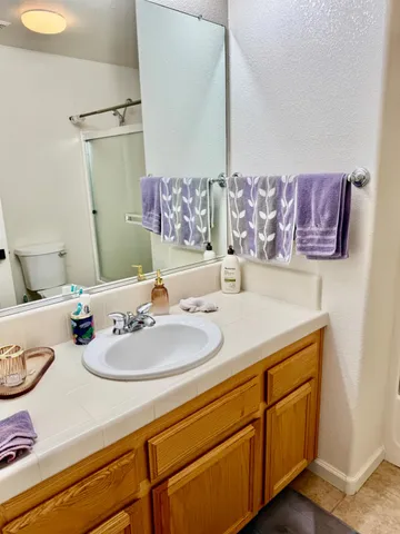 a bathroom with a shower and a toilet