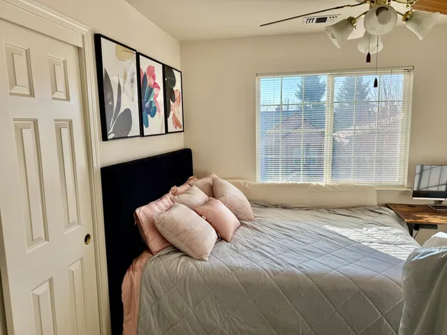 a kitchen with granite countertop a sink stainless steel appliances and cabinets