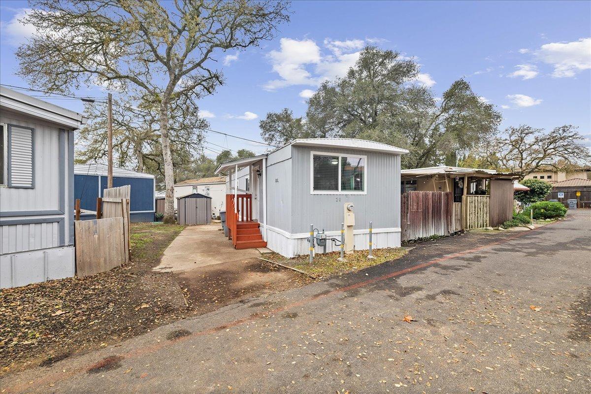 8880 Auburn Folsom Road, Unit 20 Granite Bay, CA 95746 - Photo 1 of 17 a view of a backyard with large tree