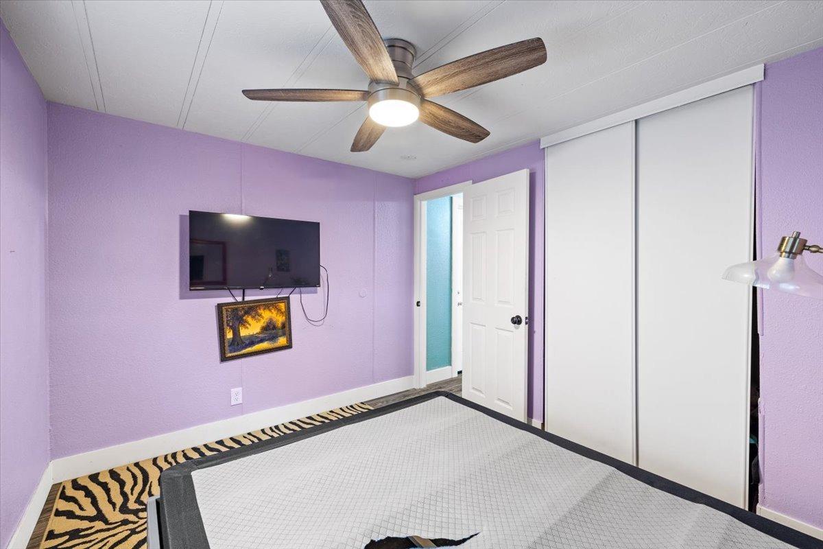 8880 Auburn Folsom Road, Unit 20 Granite Bay, CA 95746 - Photo 11 of 17 a view of an empty room with a window and a flat screen tv