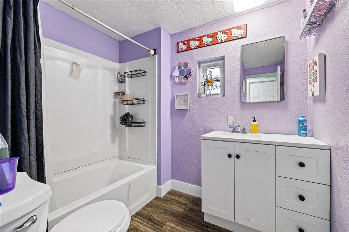 8880 Auburn Folsom Road, Unit 20 Granite Bay, CA 95746 - Photo 12 of 17 a bathroom with a sink a toilet and shower