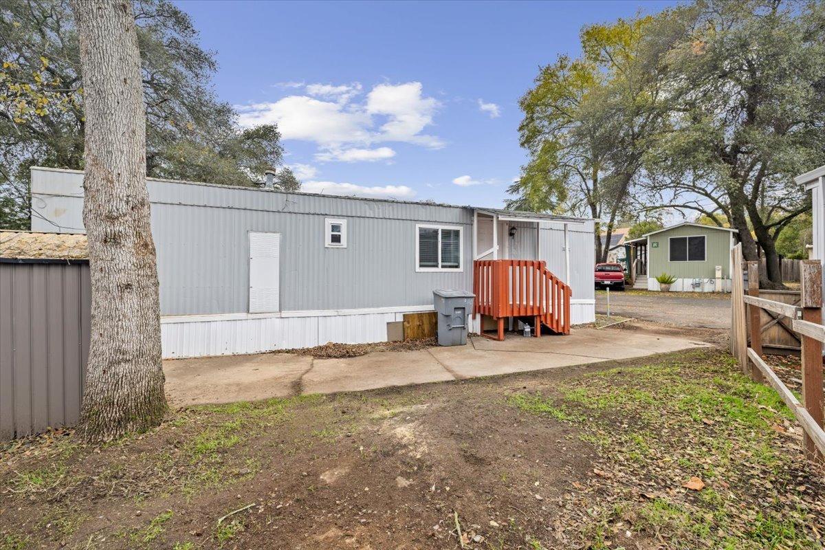 8880 Auburn Folsom Road, Unit 20 Granite Bay, CA 95746 - Photo 2 of 17 a view of a yard with a house and a tree