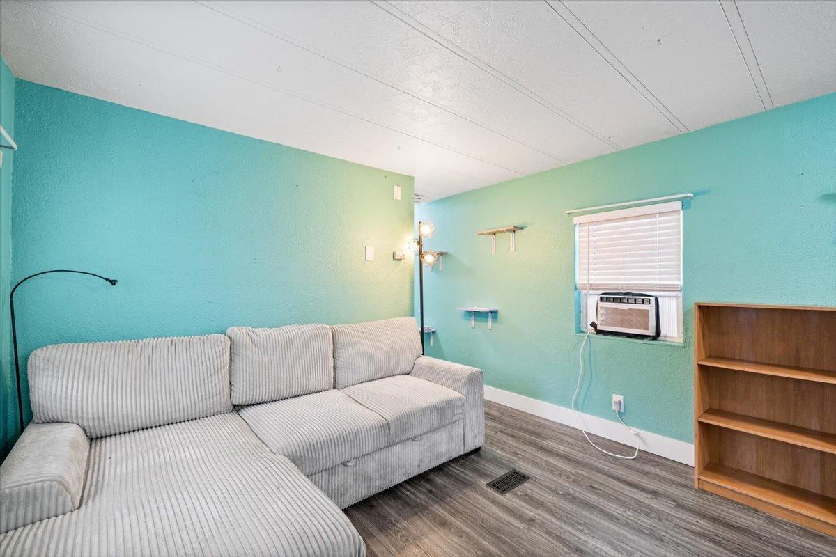 8880 Auburn Folsom Road, Unit 20 Granite Bay, CA 95746 - Photo 7 of 17 a living room with furniture and a wooden floor