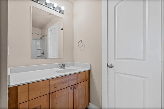 a bathroom with a sink and a mirror