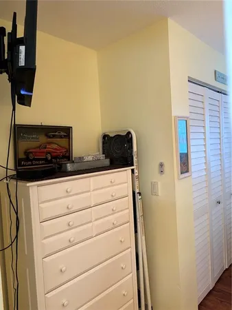 a bedroom with a bed and a table in it