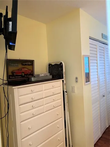 a bedroom with a bed and a table in it