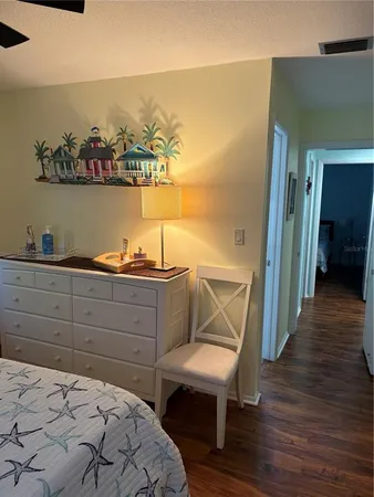 a bedroom with a bed and a table in it