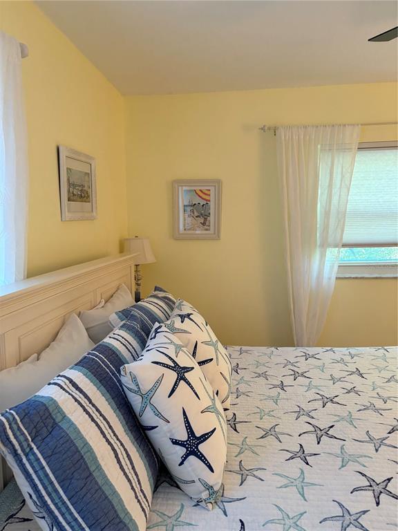 14531 Walsingham Road, Unit 224 Largo, FL 33774 - Photo 38 of 41 a bedroom with a bed and a window