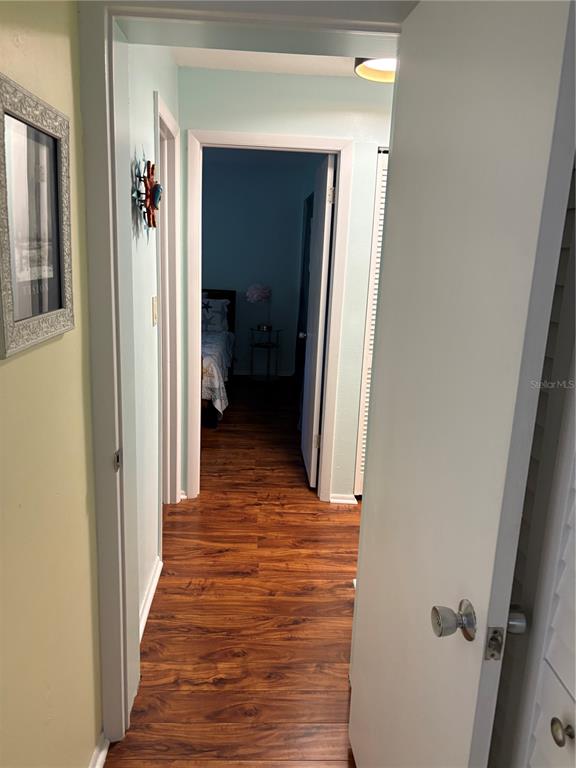 14531 Walsingham Road, Unit 224 Largo, FL 33774 - Photo 39 of 41 a view of a hallway with wooden floor and closet