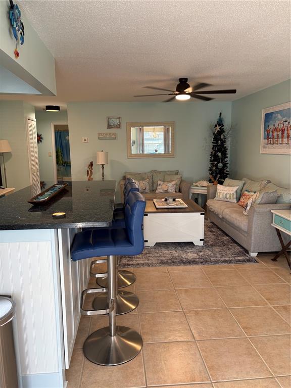 14531 Walsingham Road, Unit 224 Largo, FL 33774 - Photo 7 of 41 a living room with furniture and a wooden floor