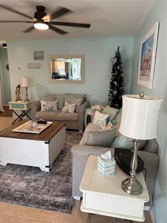 a living room with furniture and a rug