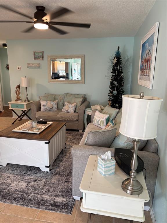 14531 Walsingham Road, Unit 224 Largo, FL 33774 - Photo 8 of 41 a living room with furniture and a rug