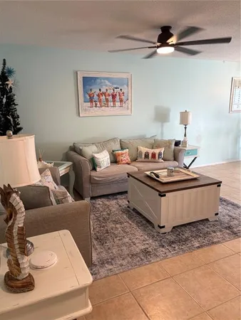 a living room with furniture and a table