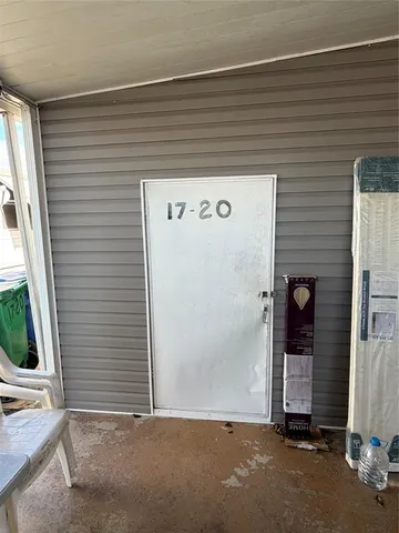a kitchen with cabinets a sink and white appliances