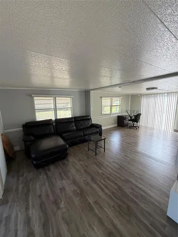 a kitchen with a table chairs and a stove top oven