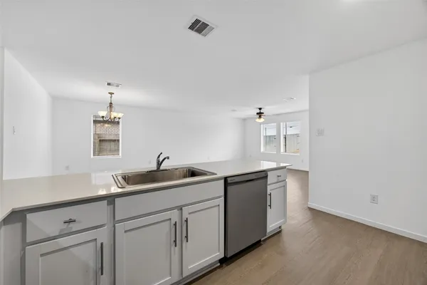 a kitchen with a sink and cabinets