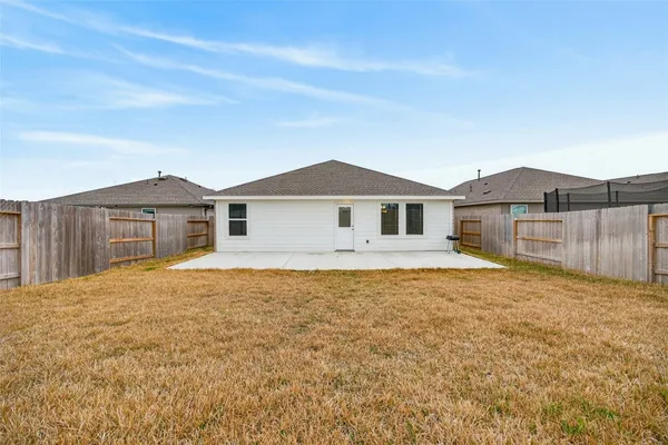 a house with yard in front of it