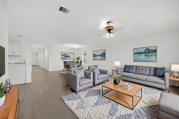 a living room with furniture and a window