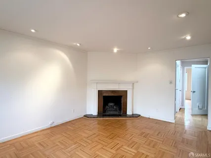 a kitchen with a checkered floor and white cabinets