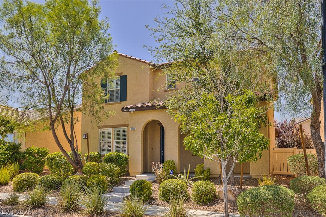 3199 Subtle Color Avenue Henderson, NV 89044 - Photo 3 of 46 Mediterranean / spanish house featuring a tiled roof and stucco siding