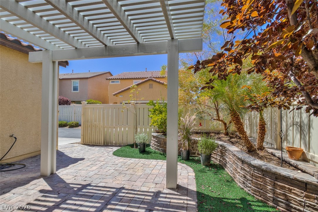 3199 Subtle Color Avenue Henderson, NV 89044 - Photo 38 of 46 Fenced backyard featuring a patio and a pergola