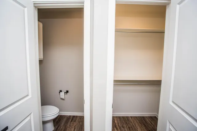 a bathroom with a toilet and a sink