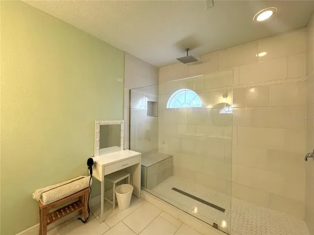 a bathroom with a sink mirror and toilet