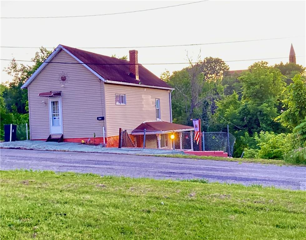 411 Rostraver Street Monessen, PA 15062 - Photo 1 of 26 front/ side of house area for parking off of the main road