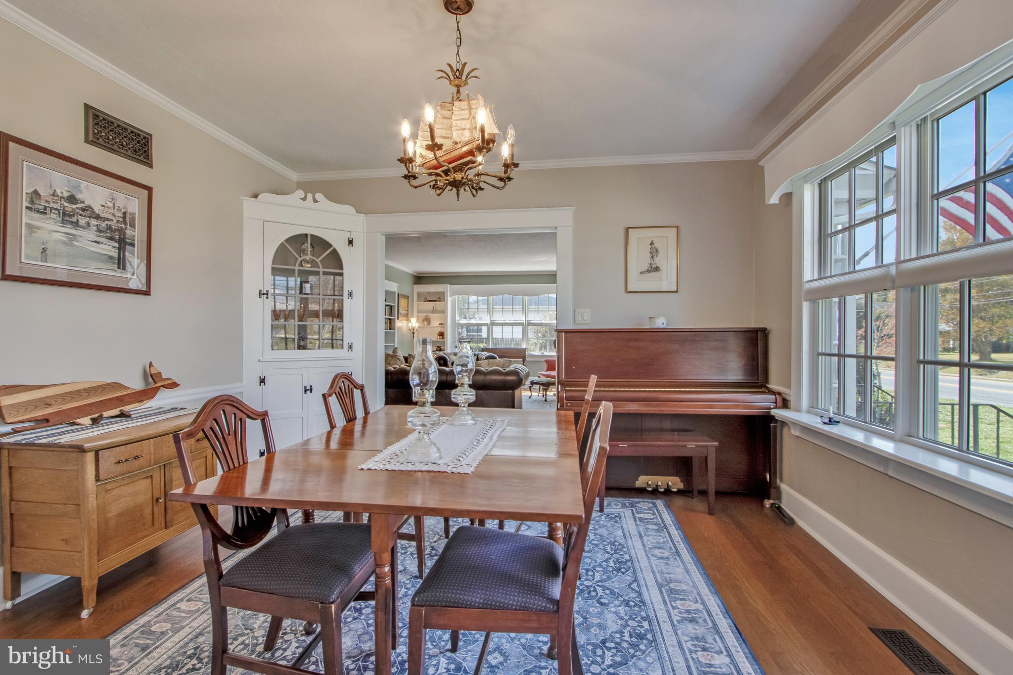901 Savannah Road Lewes, DE 19958 - Photo 14 of 83 a view of a dining room with furniture a rug and wooden floor