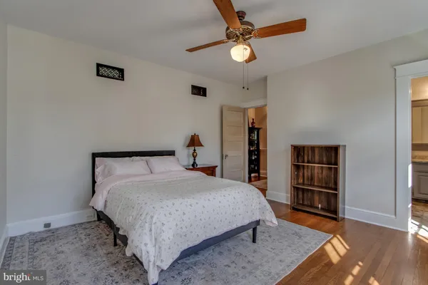 a bedroom with a bed and flat screen tv