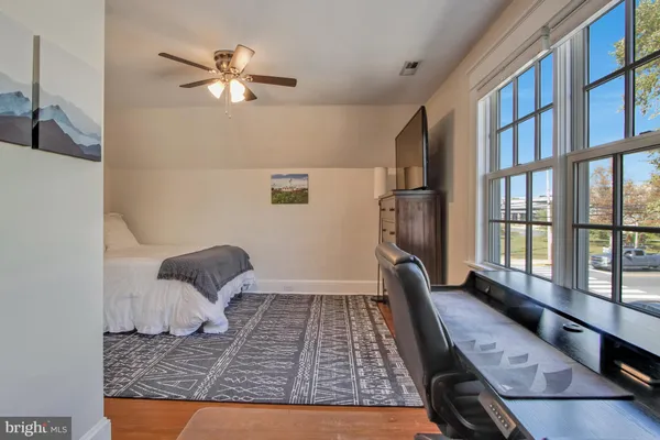 a view of a livingroom with furniture and lounge chair