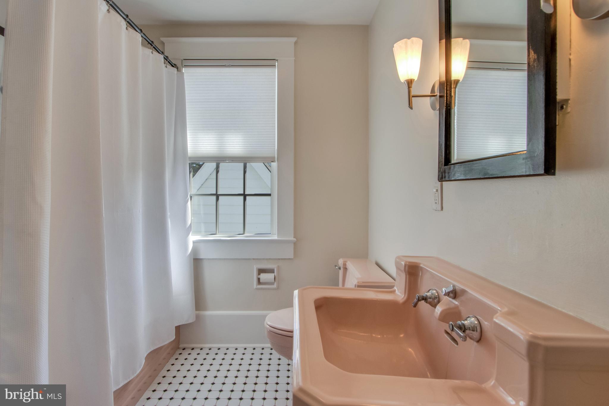 901 Savannah Road Lewes, DE 19958 - Photo 28 of 83 a bathroom with a sink a toilet and shower