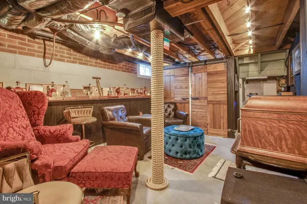 a view of entryway with a table and chair