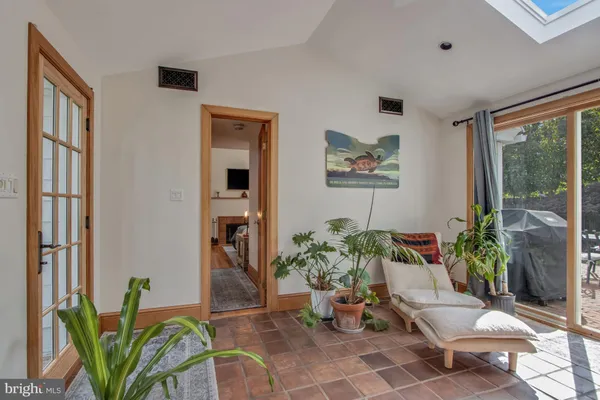 a view of a house with backyard porch and sitting area