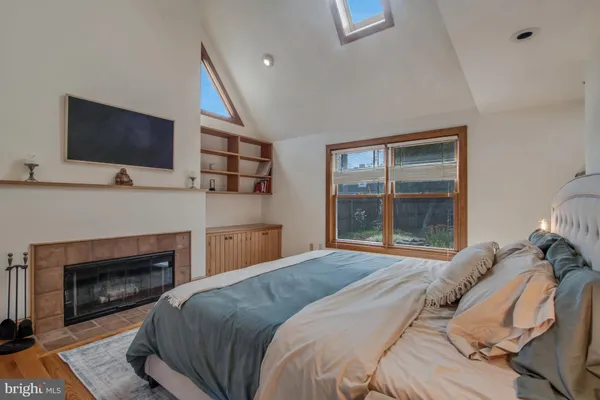 a aerial view of a house next to a yard