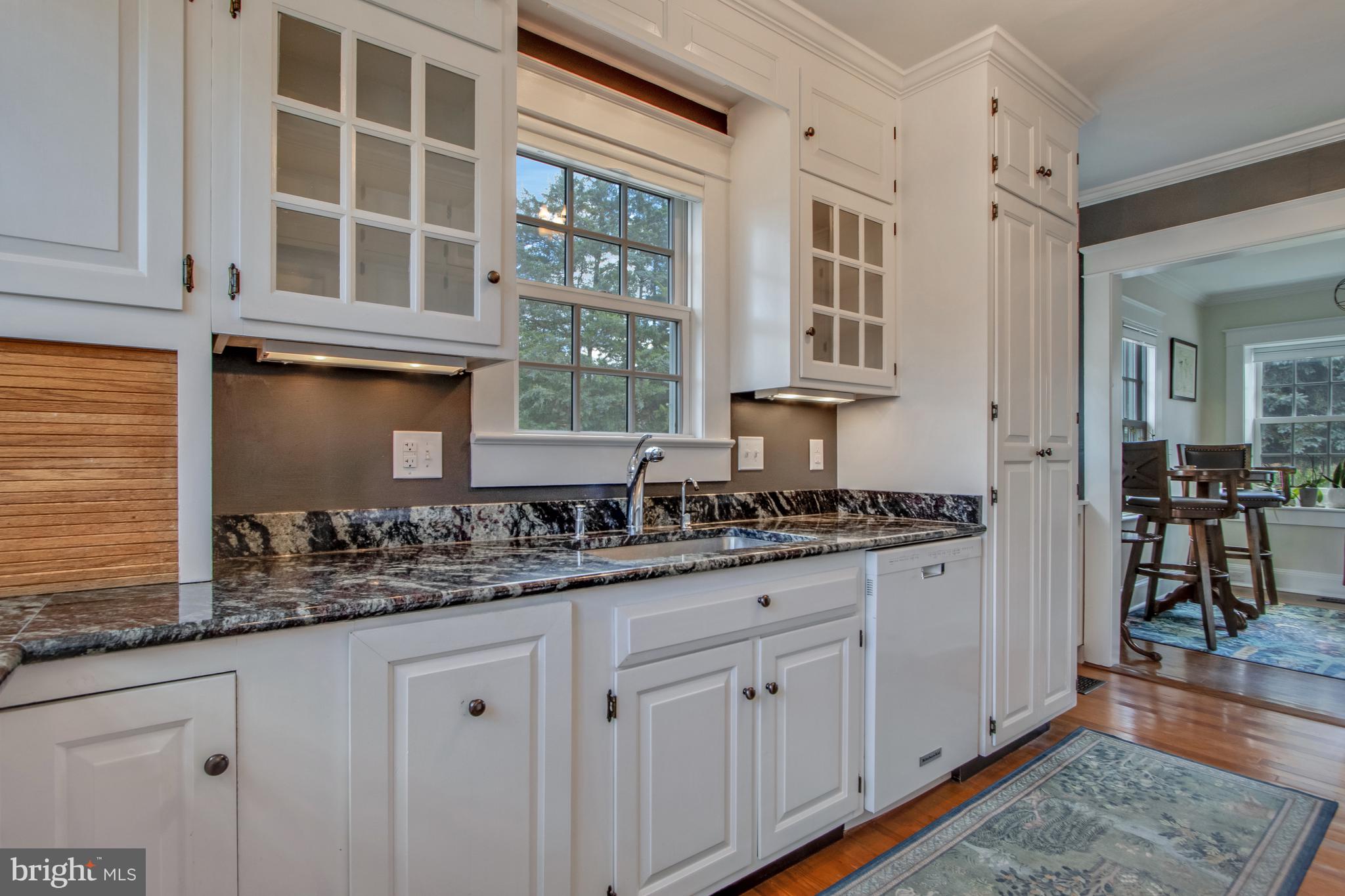 901 Savannah Road Lewes, DE 19958 - Photo 64 of 83 a kitchen with stainless steel appliances granite countertop a stove and a sink