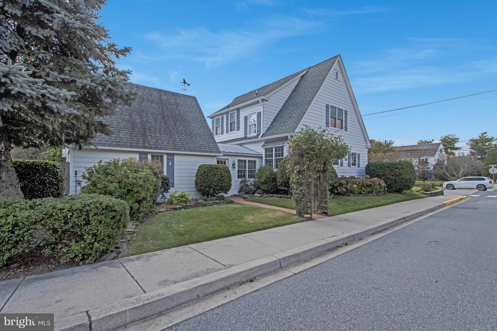 901 Savannah Road Lewes, DE 19958 - Photo 79 of 83 a front view of a house with a yard and garage