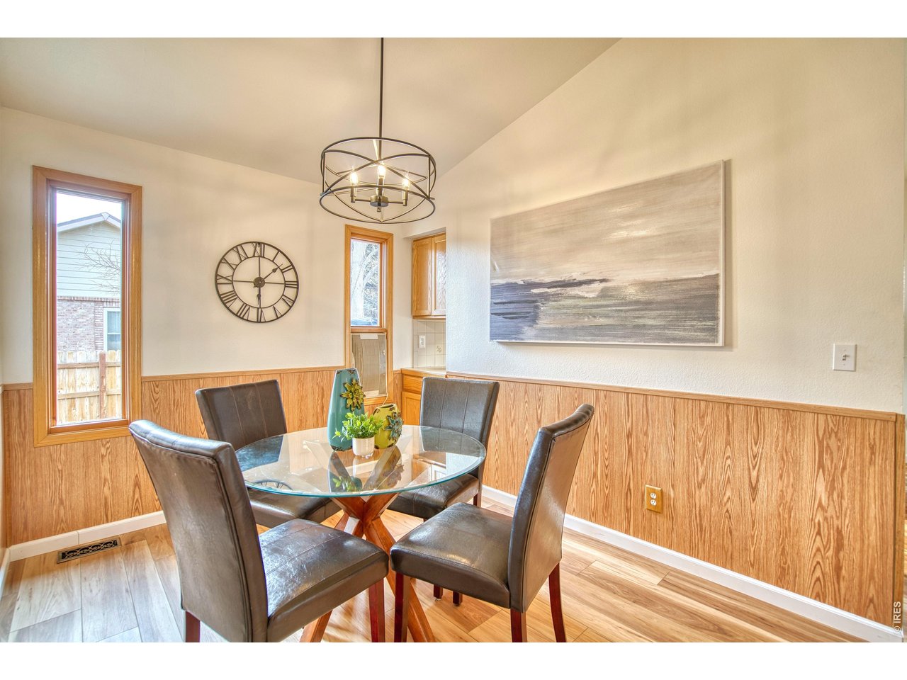 824 Wade Road Longmont, CO 80503 - Photo 15 of 34 a view of a dining room with furniture window and wooden floor