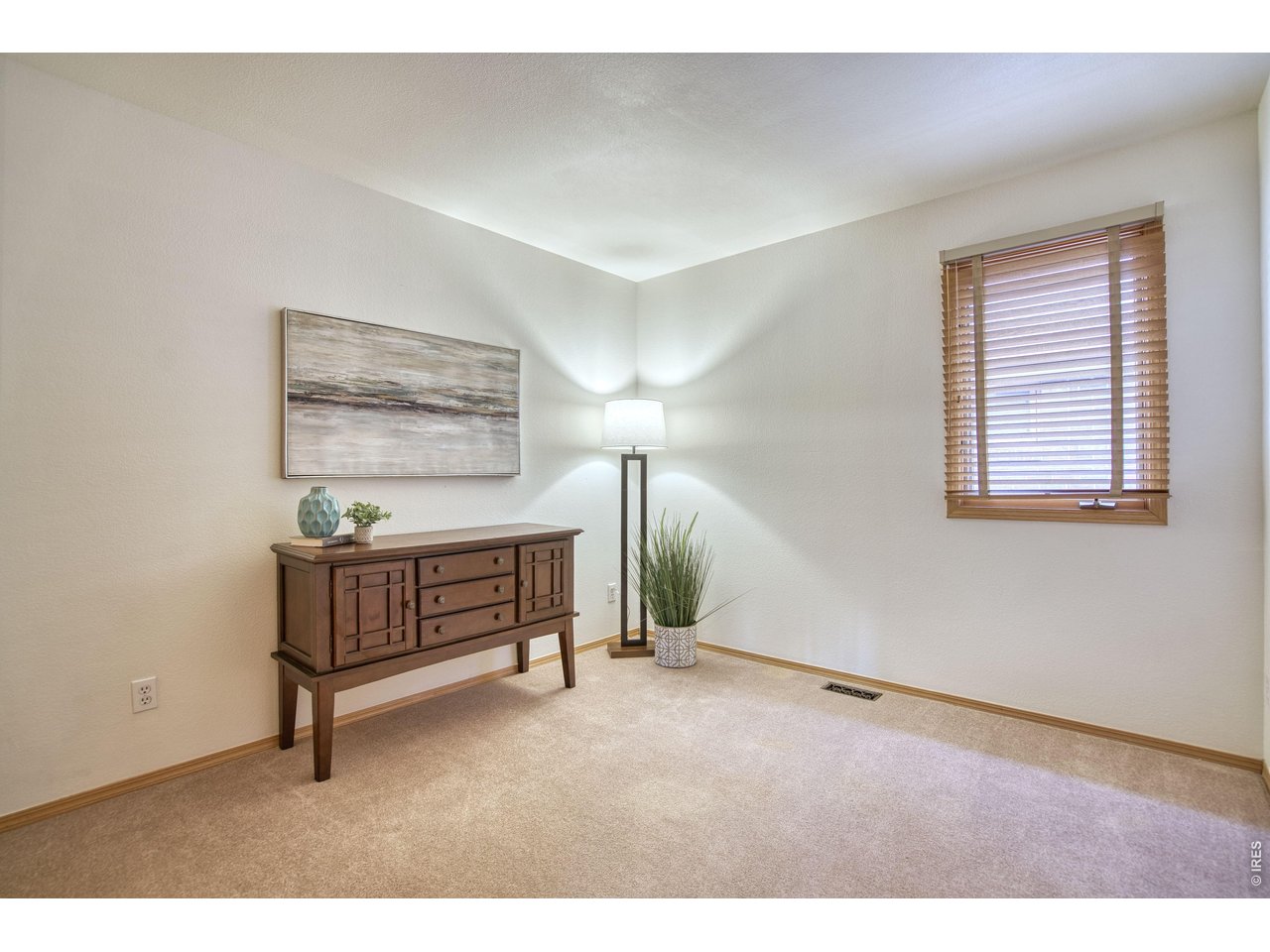 824 Wade Road Longmont, CO 80503 - Photo 21 of 34 a bedroom with furniture and a window