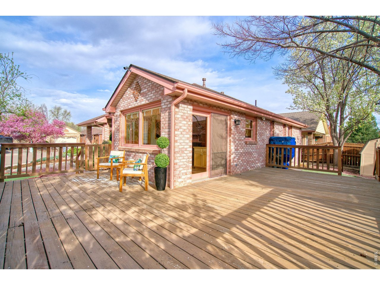 824 Wade Road Longmont, CO 80503 - Photo 3 of 34 a view of a house with a patio