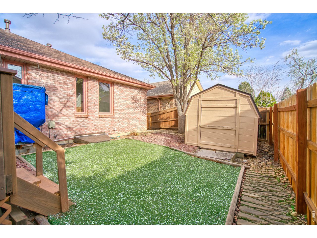 824 Wade Road Longmont, CO 80503 - Photo 31 of 34 a view of a backyard with a garden