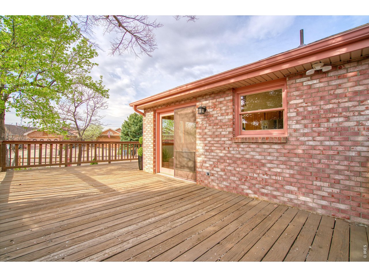 824 Wade Road Longmont, CO 80503 - Photo 32 of 34 a view of backyard with wooden floor and fence