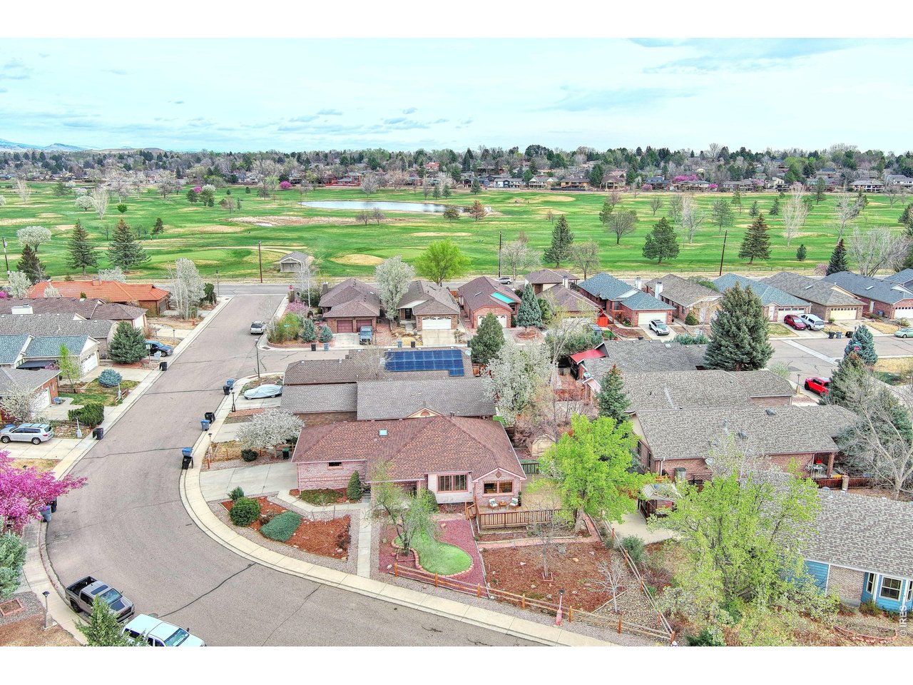 824 Wade Road Longmont, CO 80503 - Photo 33 of 34 a view of a lake with a city