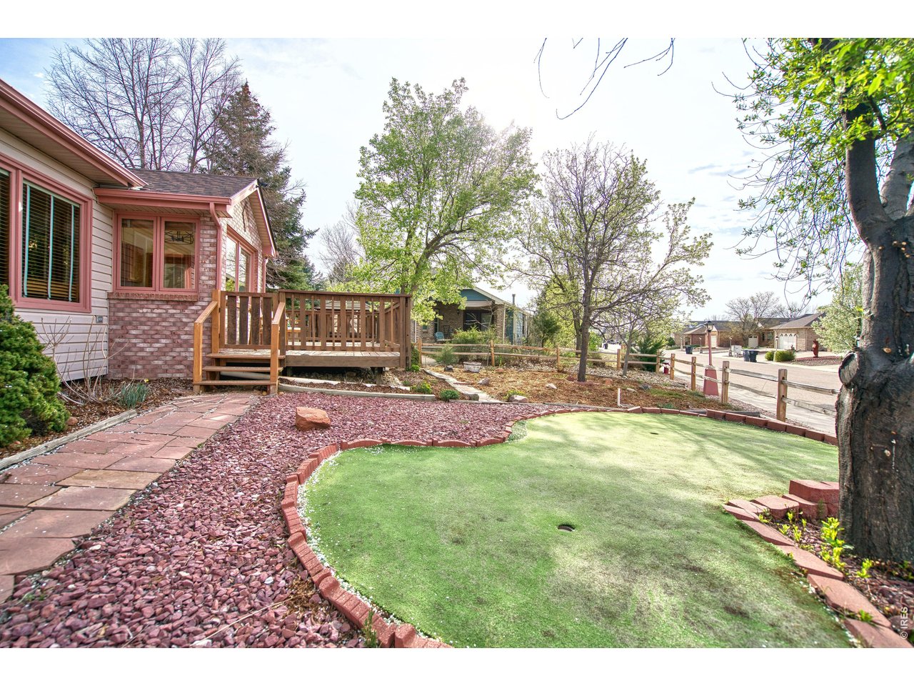 824 Wade Road Longmont, CO 80503 - Photo 4 of 34 a view of a house with backyard and sitting area