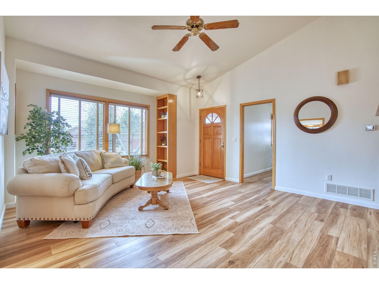 824 Wade Road Longmont, CO 80503 - Photo 6 of 34 a living room with furniture and wooden floor