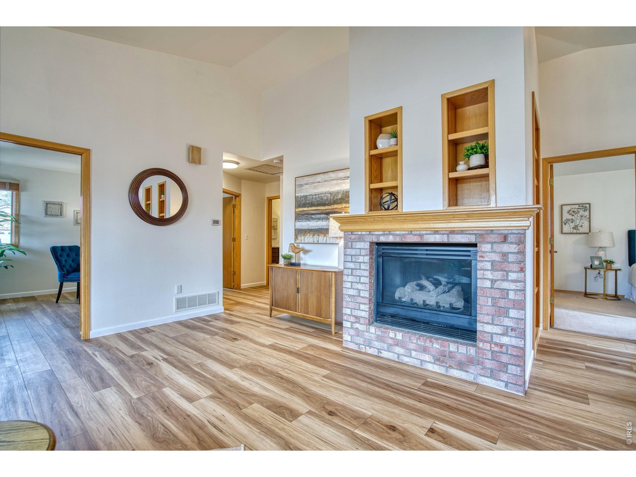 824 Wade Road Longmont, CO 80503 - Photo 7 of 34 a view of an empty room with wooden floor and a fireplace