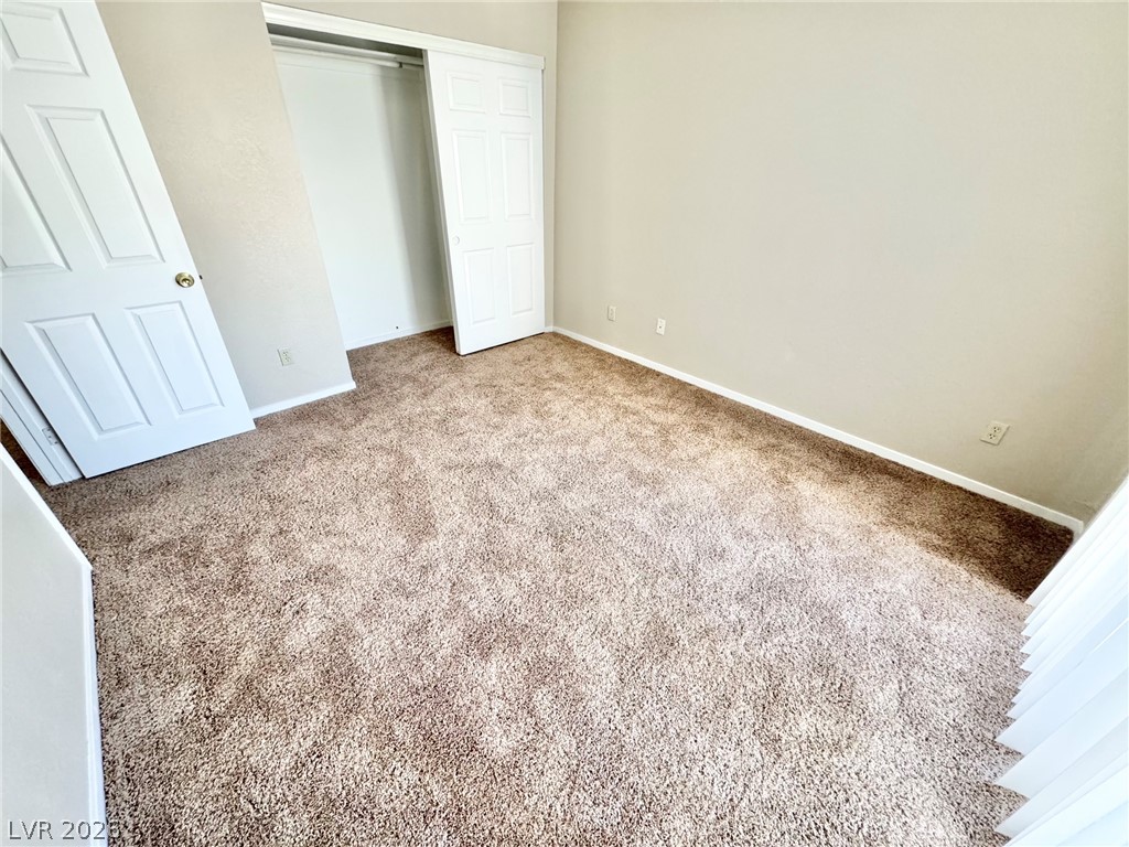 6250 West Flamingo Road, Unit 109 Las Vegas, NV 89103 - Photo 16 of 18 A well-maintained bedroom offers ample space, fresh carpet, and a convenient closet for storage.