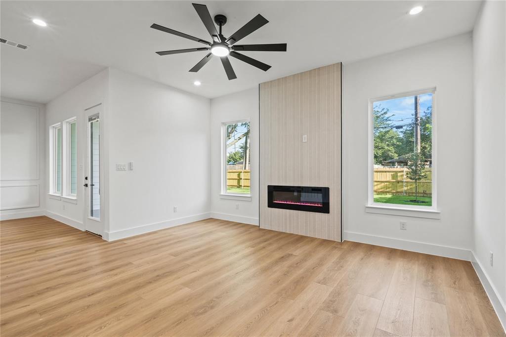 2820 Barnes Bridge Road Dallas, TX 75228 - Photo 15 of 29 wooden floor in an empty room with a window