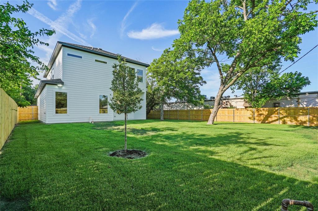 2820 Barnes Bridge Road Dallas, TX 75228 - Photo 27 of 29 a backyard of a house with plants and large tree